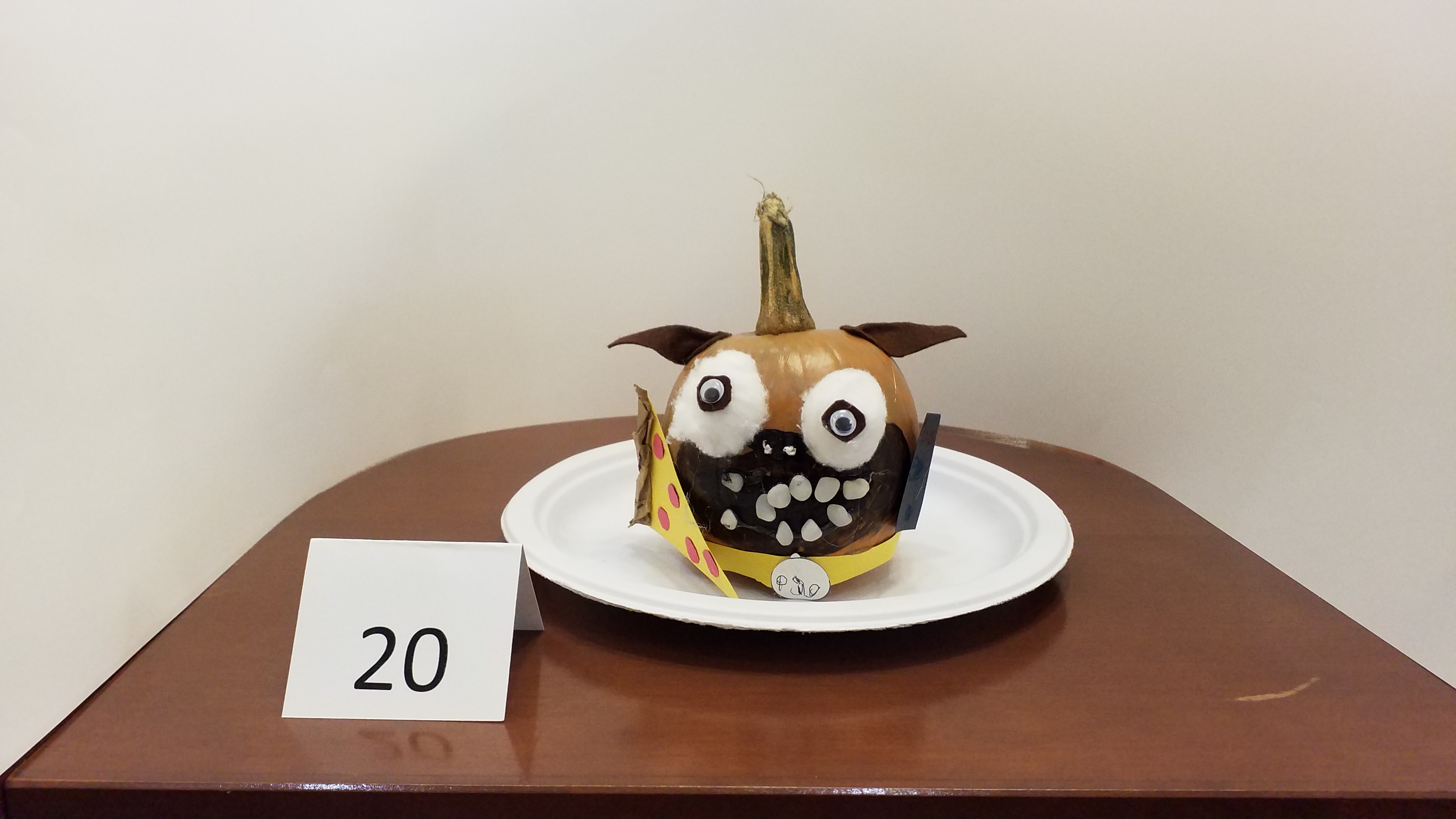 Pumpkin decorated as frenzied pizza dog