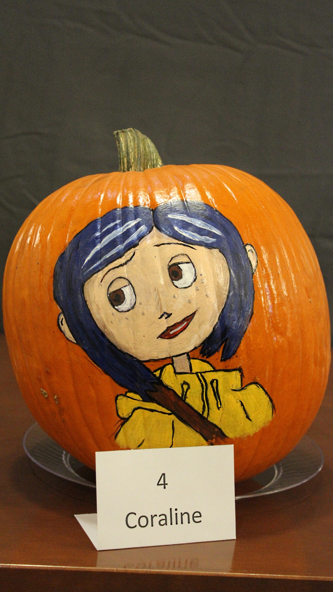 Pumpkin decorated as Coraline