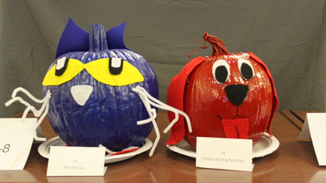 Pumpkins decorated as Pete the Cat and Clifford the Big Red Dog