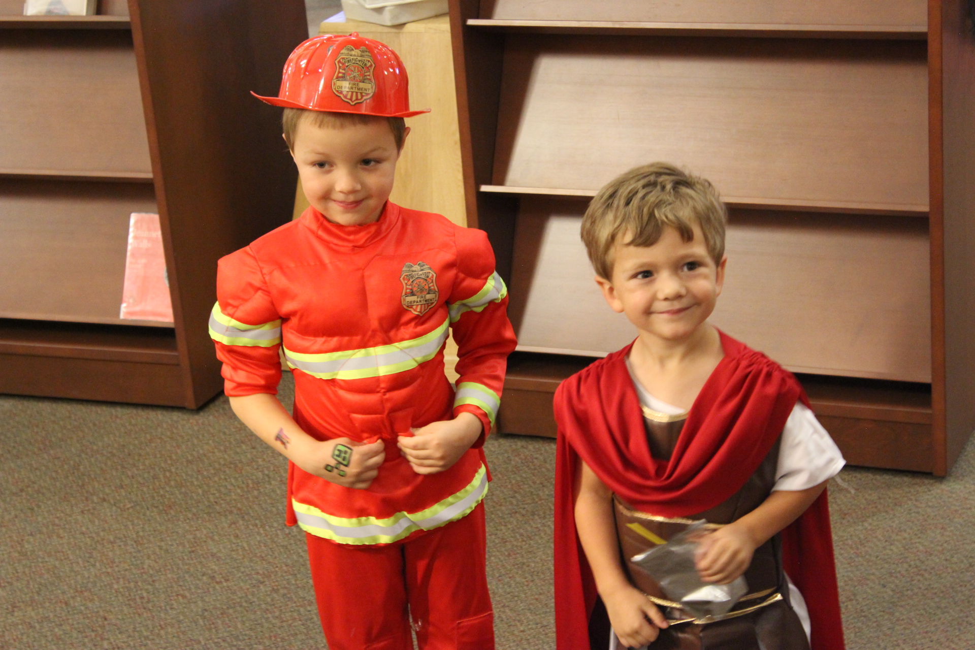Children dressed as fireman and Roman legionnaire