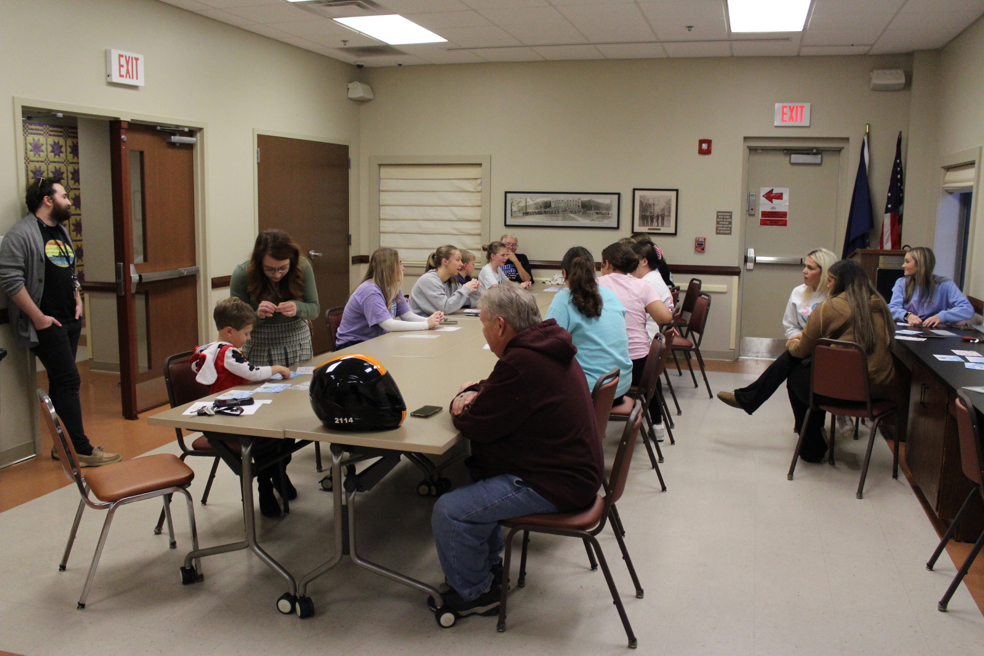 Library patrons creating braille word cards with art supplies