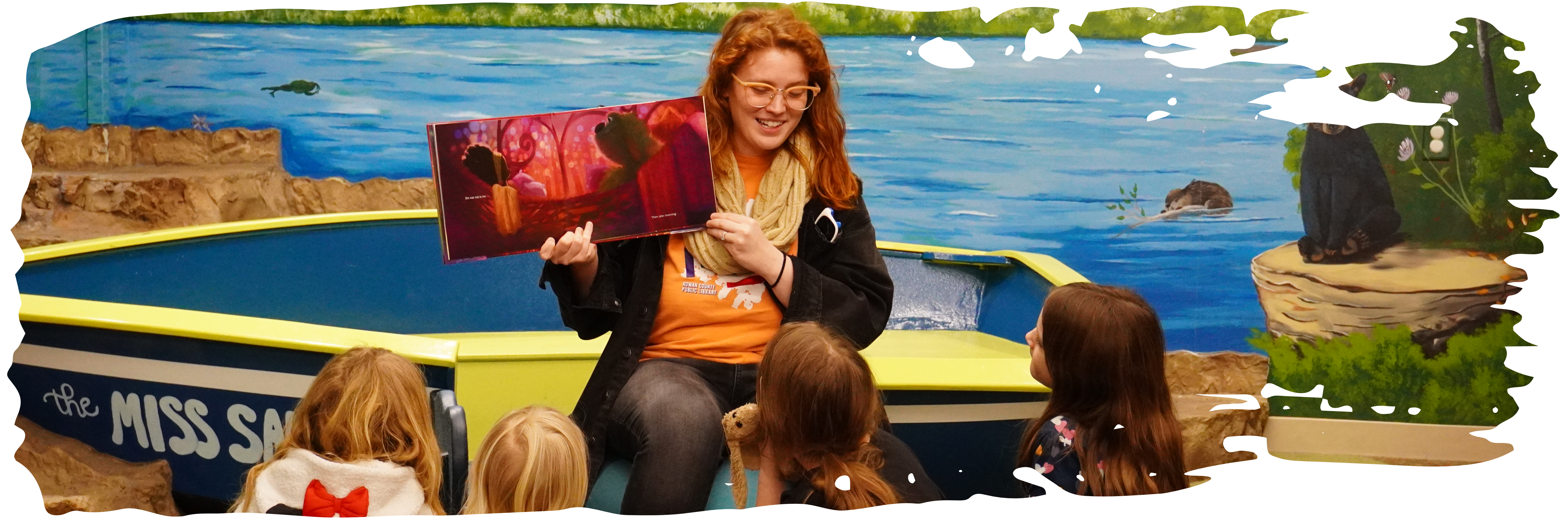 Children's librarian Atlanta reading to young storytime attendees