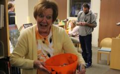 Children's Librarian Sandy with a bowl of Halloween candy