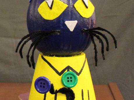 Pumpkin decorated as Pete the Cat on skateboard